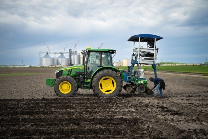 A tractor in a farm field.