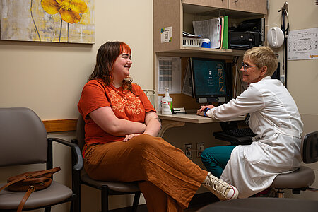 Student meeting with a provider in a Student Health exam room Student meeting with a provider in a Student Health exam room